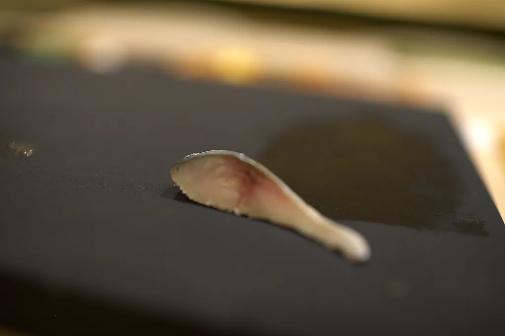 A slice being taken from a fillet in a single pull